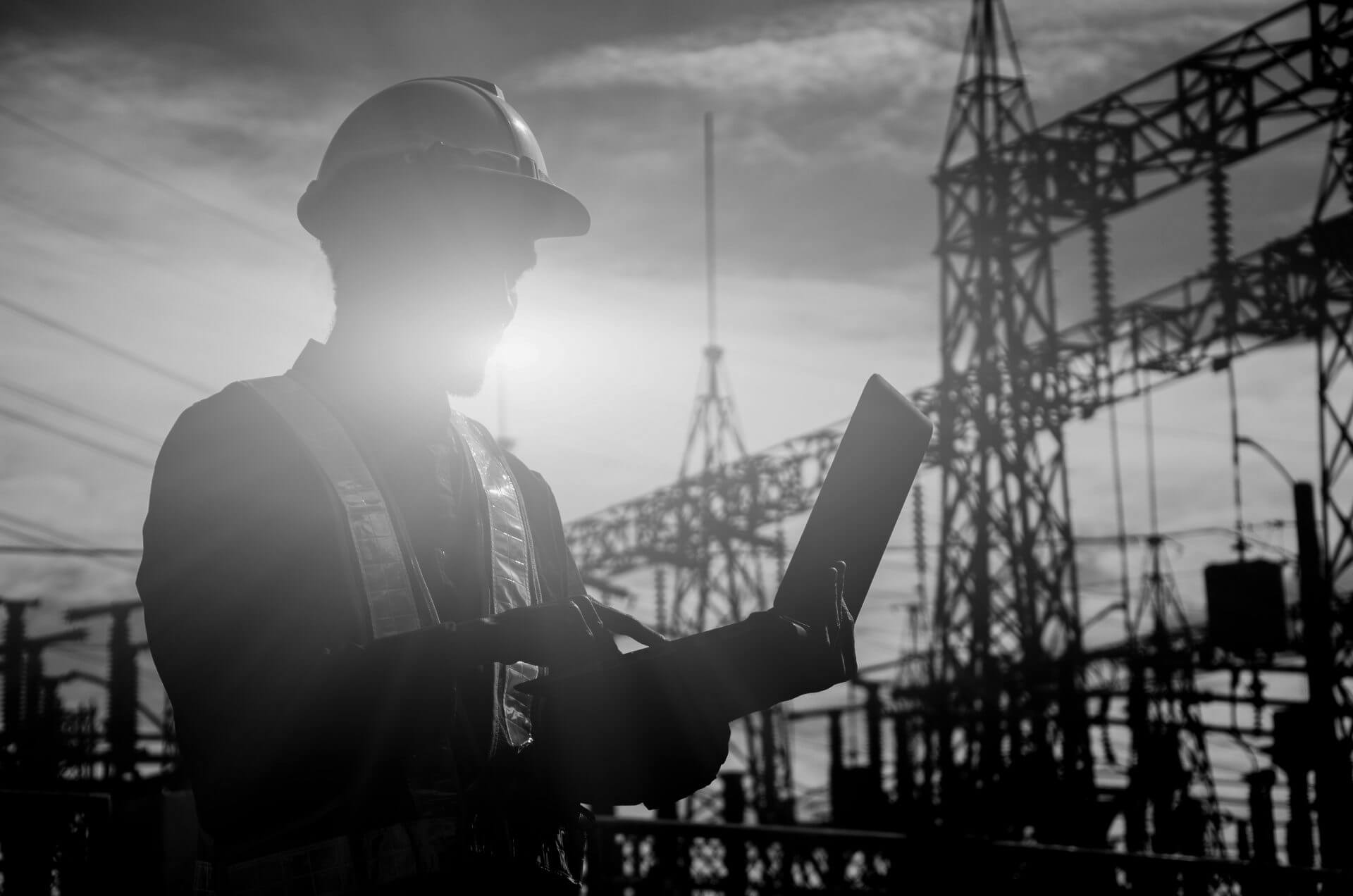Silhouette of working engineer in the construction site.loading=